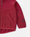 Reima Hopper Fleecejacke Kinder Cranberry Detailansicht Tasche und Ärmel